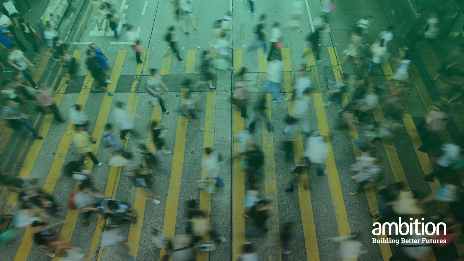 Busy street with lots of people crossing the road at once