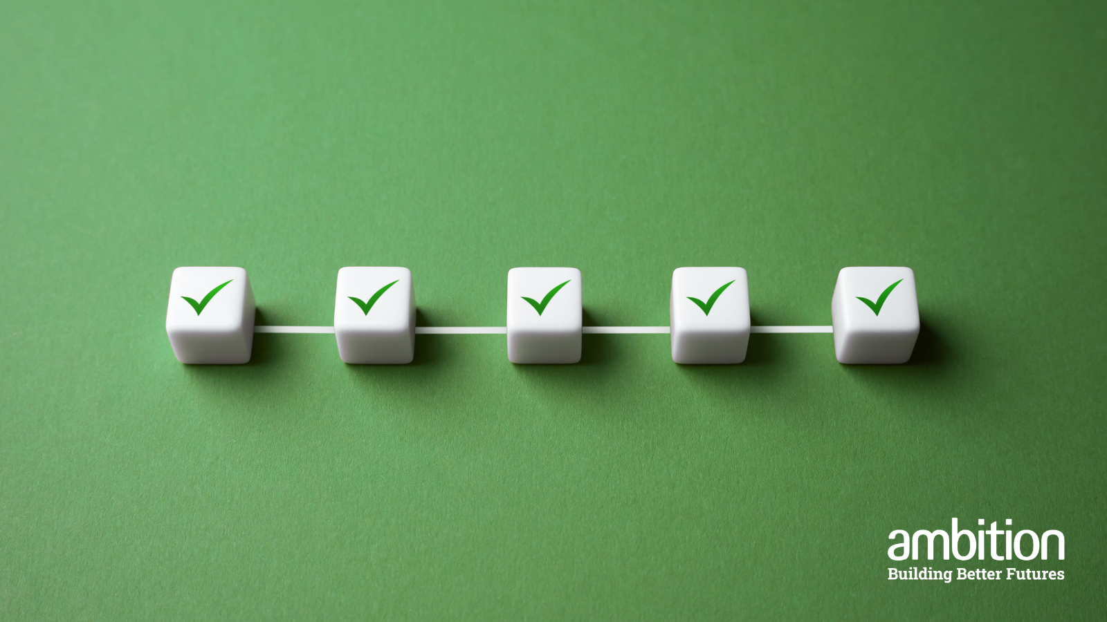 Green background with 5 white cubes that have green ticks on them, which are all connected by one line
